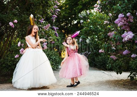 Lovely Sisters Made Of Cardboard Crowns And Play Princesses.