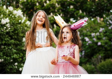 Lovely Sisters Made Of Cardboard Crowns And Play Princesses.