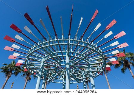 Xiamen, China - Mar 31, 2018: Statue Of Iron Paddle Link To Circle With Blue Sky Background At Lujia