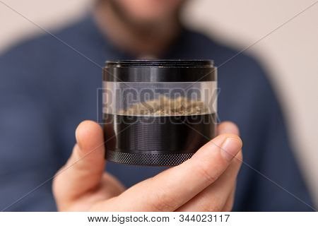 Man Preparing And Rolling Marijuana Cannabis Joint. Man Rolling A Marijuana Joint. Drugs Narcotic Co