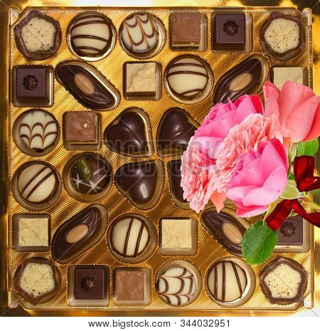 Variety Of Chocolate Candies And Roses. Luxurious Box Of Chocolates.decorated Chocolate Candies, Bit