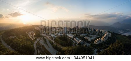 Aerial View Of Residential Buildings On Top Of Burnaby Mountain During A Vibrant Sunset. Taken In Gr