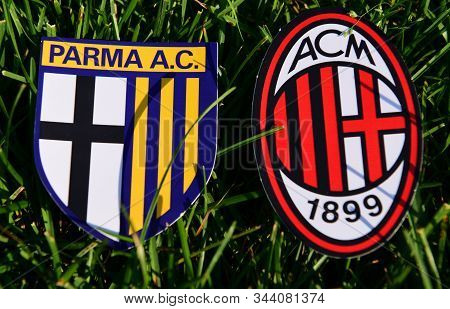 September 6, 2019, Turin, Italy. Emblems Of Italian Football Clubs Milan And Parma On The Green Gras