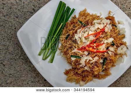 Asian Eating Food, Mee Grob Is An Sweet And Sour Crispy Noodles, Made From Thai Rice Noodle With Swe
