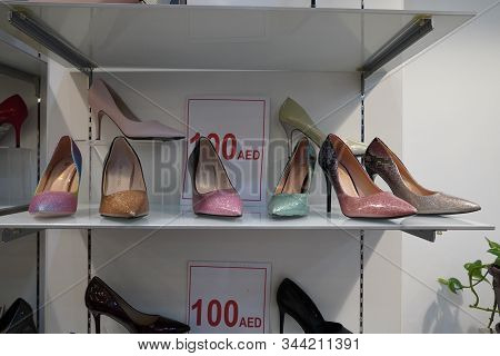 New Colorful Footwear With High Heel On Racks In Shopping Mall. Pointed Stilettos Display On Shop Fr