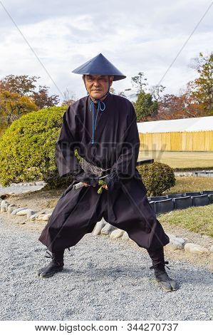 Matsumoto, Japan - November 4th, 2018: A Guard Of Matsumoto Castle, Dressed In Traditional Uniform.