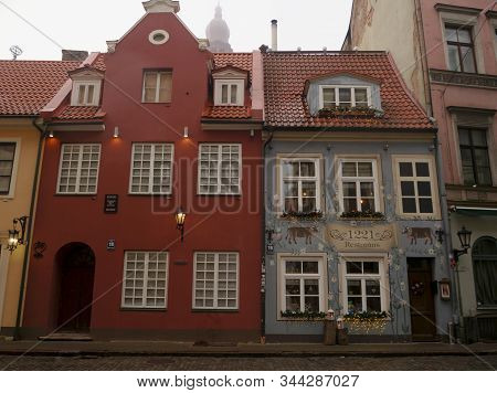 Famous Riga Restaurant 1221 With Cows Painted On The Facade In Christmas Decorations, A Historical A
