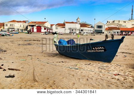 Miramar, Porto, Portugal- January 8, 2020: Colorful Fishing Boats Stranded On Aguda Beach And Little