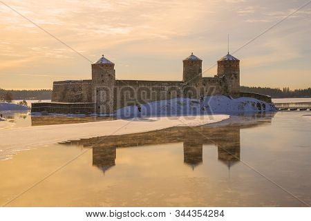 View Of The Old Olavilinna Fortress At Sunrise On A March Morning. Savonlinna, Finland