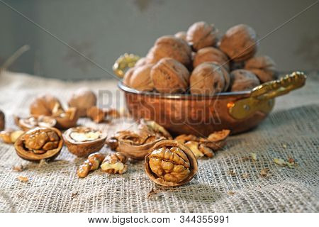 Walnuts. Composition With Wallnuts On The Sackcloth. Nuts On The Table.