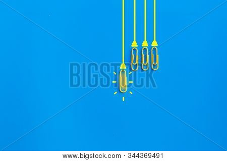 Great Ideas Concept With Paperclip,thinking,creativity,light Bulb On Blue Background,new Ideas Conce