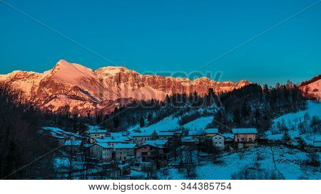 Sunset In The Mountains Between Slovenia And Italy In A Freezing Winter Day
