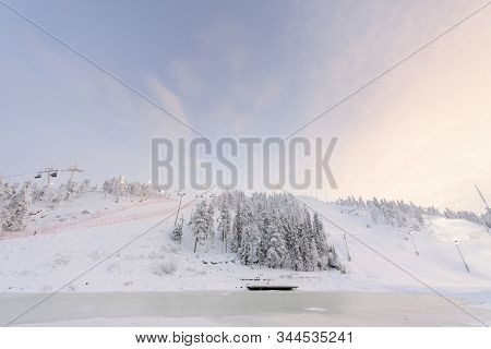 Rukatunturi Ski Jumping Hill In Winter Season And Nice Weather And Blue Sky In Winter Season And Sun