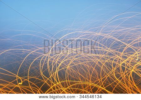 Creative Photography With Unusual Pattern Of Dancing Light Or Neon In Chaotic Lines On Abstract Back