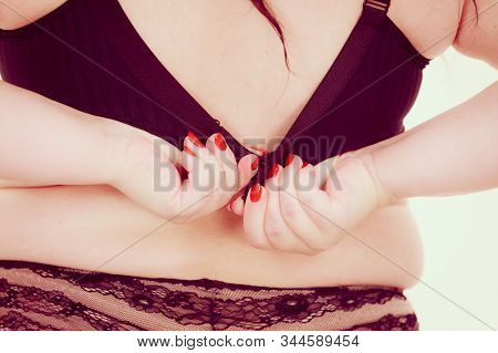 Fat Woman Rear View Opening Taking Off Or Putting On Her Bra. Plus Size Overweight Female Model Wear