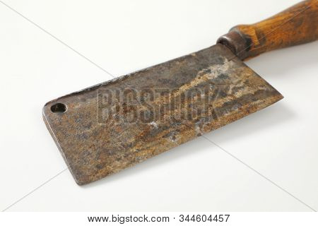 Old rusty chopping knife with wooden handle