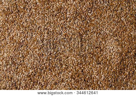 Brown Flax Seed Background. Linen Background. Texture.