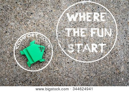 Exit From The Comfort Zone Concept. Dark Green Frog Jump Out Of The Circle Of Comfort Zone