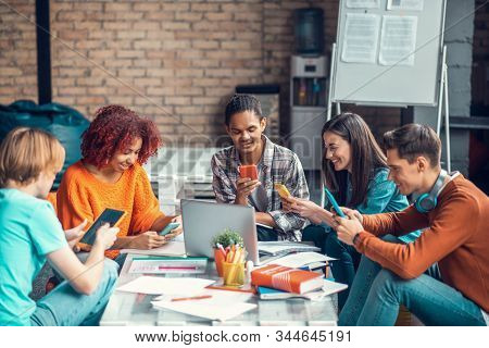 Students Using Their Gadgets While Having Little Break