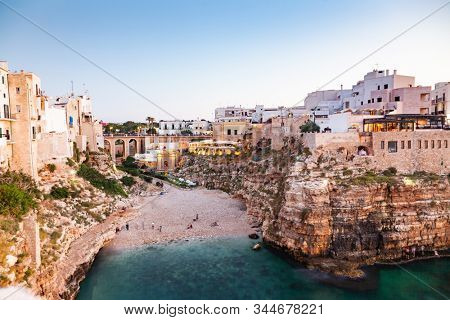 cala Paura gulf with Bastione di Santo Stefano and Lama Monachile beach in background. Polignano a Mare, Apulia, Italy, province of Bari.