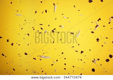 White And Dark Chocolate Pieces And Chipson On A Bright Yellow Background. View From Above. Flat Lay