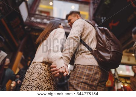 Newlywed Couple Showing Affection And Holding Hands In Shanghai Near Yuyuan While Visiting China