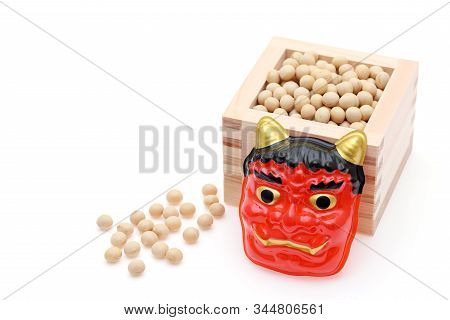 Japanese Traditional Setsubun Event, Soybeans And Masks Of Oni Demon And Otafuku Are Used On An Annu