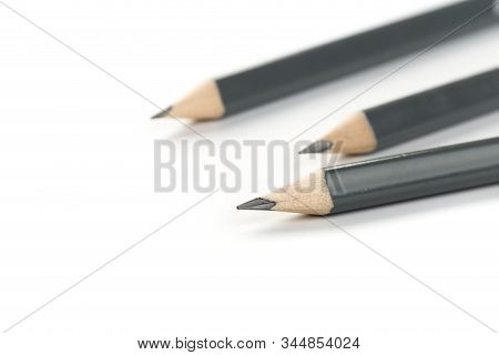 Three  Gray Triangular Pencil Isolated
On White Background