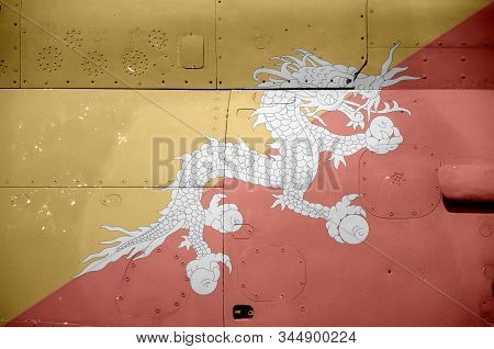 Bhutan Flag Depicted On Side Part Of Military Armored Helicopter Closeup. Army Forces Aircraft Conce