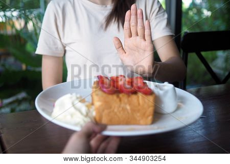 Women Refuse To Eat Sweets For Weight Loss And Good Health.