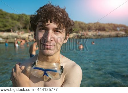 Portrait Of A Cute Caucasian Young Man Standing At The Bay Of Porto Selvaggio, Puglia, Italy. Tell U