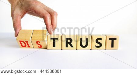 Distrust Or Trust Symbol. Businessman Turns Wooden Cubes, Changes Words 'distrust' To 'trust'. Beaut