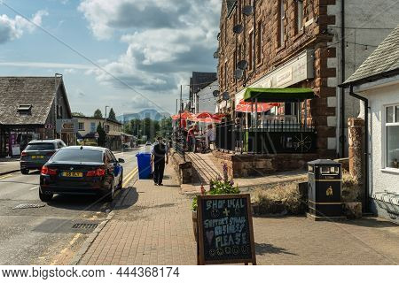 Aberfoyle, Scotland - July 25th 2021: Main Street In Aberfoyle In Summer With Ben Lomond In The Back