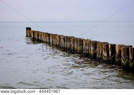 Groynes As Coastal Protection On The Beach Of The Baltic Sea.