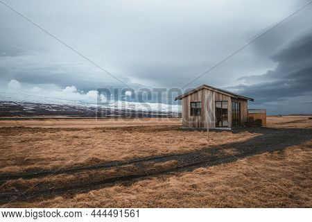 Cosy Log Cabin Retreat In Snow Covered Landscape, Iceland, Europe. Iceland Nature With Typical Yello