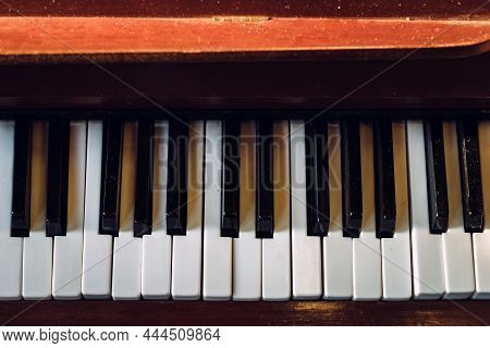 Close Up Shot To Broken Piano Keys In Abandoned House. An Ancient Musical Instrument. Old Broken Dis