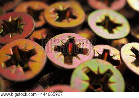 Anodized Screw Caps Close-up. A Vivid Illustration On The Theme Of Hardware And Fasteners. Materials
