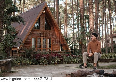 Happy Man In Sweater Traveling In Pine Tree Forest, Tourist Visit At Doi Bo Luang, Chiang Mai, Thail