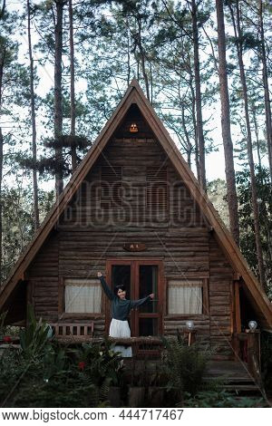 Happy Woman In Sweater Traveling In Pine Tree Forest, Tourist Visit At Doi Bo Luang, Chiang Mai, Tha