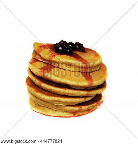 Stack Of Pancakes With Blackcurrant At The Top, Isolated On White Background. American Tasty Pancake