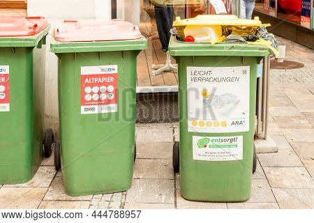 Graz, Austria - August 23, 2021: Waste Paper And Lightweight Packaging Containers In The Downtown Of