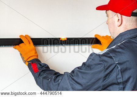 Worker  With Bubble Level. Measuring  With Bubble Level.measurement Accuracy Concept, Modern Measure