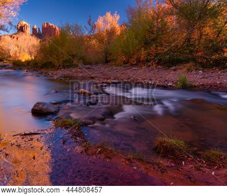 Cathedral Rock At Sunset With Oak Creek In The Foreground
