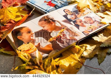 Photobook On The Leaves Background, Closeup Of Photobook, Family Photo Album