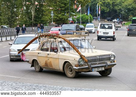 Tbilisi, Georgia - October 10, 2021: Old Soviet Saloon Car Gaz 24 Volga In A City Street.