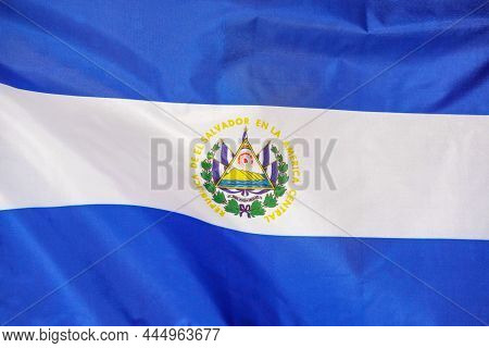 Fabric Texture Flag Of El Salvador. Flag Of El Salvador. El Salvador Flag Is Depicted On A Sports Cl