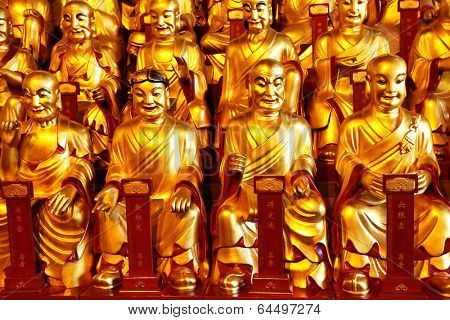 Gold statues of the Lohans in Longhua buddhist temple, Shanghai, China