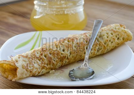 Rolled pancake  and honey