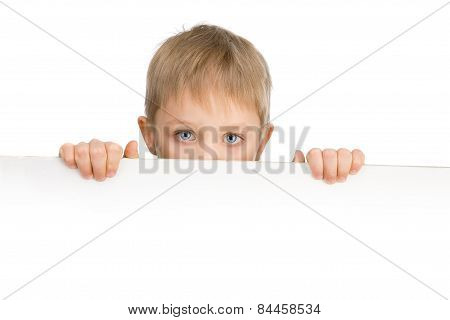 Cute 6 Years Boy With Blue Eyes Holding A Sigh