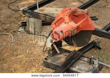 Mechanic Cutting A Steel At The Park